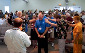 Members of East Shore Baptist Church in Harrisburg, Pa., pray over a missions team being sent out to share the Gospel. Missions is a key component of the purpose of the Cooperative Program-supporting church. 
