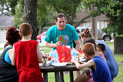 Lazybrook Baptist Church pastor John Neesley shares the gospel with participants at a block party the church hosted as part of Crossover Houston in 2013. Service evangelism is the heart of the 2014 emphasis for God’s Plan for Sharing, a ministry supported by the Evangelism Networks/Resources area of the North American Mission Board’s evangelism group. NAMB photo by Susan Whitley