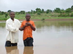 Pastor Faustin Alobo baptizing a new believer in Malawi