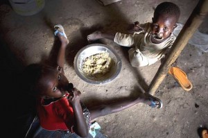 Children displaced by recent fighting eat their daily meal at a displacement site on the Tomping base of the United Nations peacekeeping mission in South Sudan (UNMISS) in the capital city of Juba.  Photo © UNICEF/NYHQ2014-0344/Holt, used with permission.