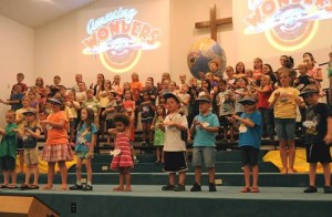 Children at Vacation Bible School present their "Family Night" program on the Friday night of VBS week, which drew 100 youngsters this year and 74 adult and youth leaders.  Photo by Karen Quinn. 