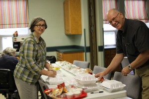 Jeff Woolum, pastor of First Baptist Church, Perrysburg, Ohio, and wife Karen prepare a meal for Missionfest volunteers.