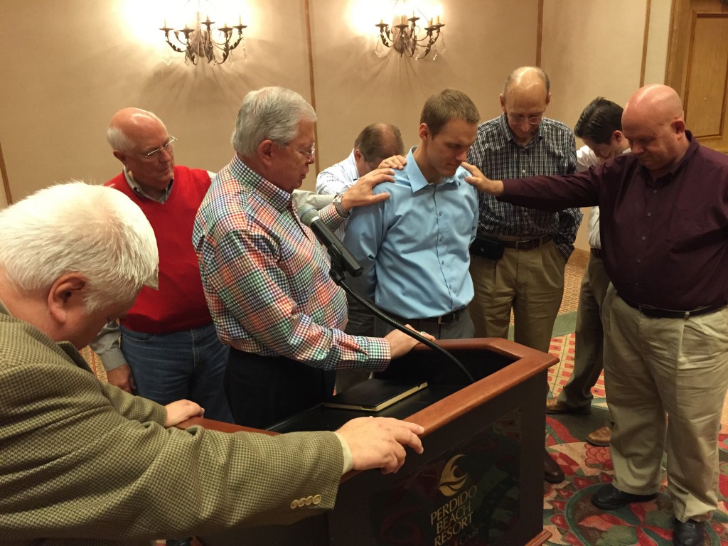 Baptist state executives and editors from around the country surround and pray for David Platt, newly elected president of the International Mission Board. Platt had shared with the group his five desires for the IMB during his time at the helm. Photo by Van Payne/IMB