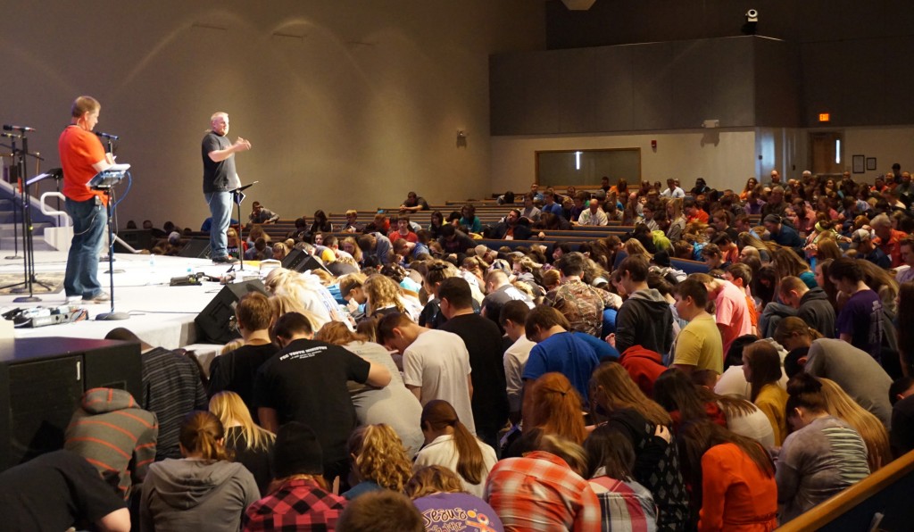 Jonathan Meyer and Jason Epperson,  the Next Gen teaching pastor at Southeast Christian Church in Louisville KY pray over students who are preparing to return to their schools and lead others to Christ. 