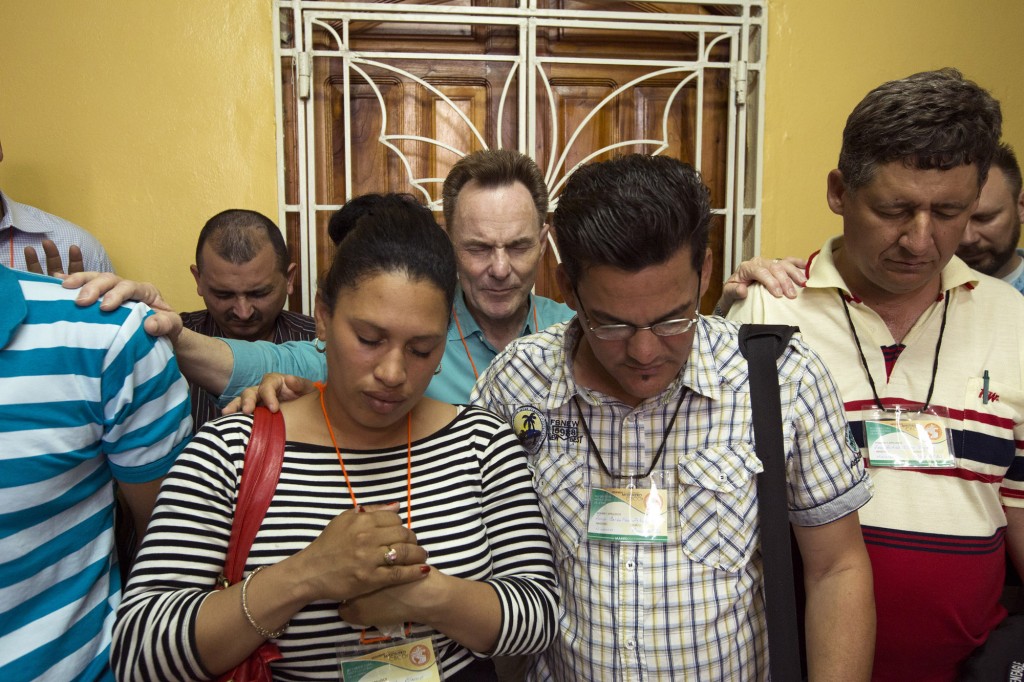 During a late-March missions congress in eastern Cuba, Southern Baptist Convention President Ronnie Floyd (center) prays over some Cuban Baptists who soon will go out as international missionaries. Floyd said he was moved by hearing testimonies of Cuban Baptists willing to "forsake all" in order to answer God's call to global missions. "It was a powerful, engaging experience for me -- one that I will never forget." Photo by Chris Carter/IMB
