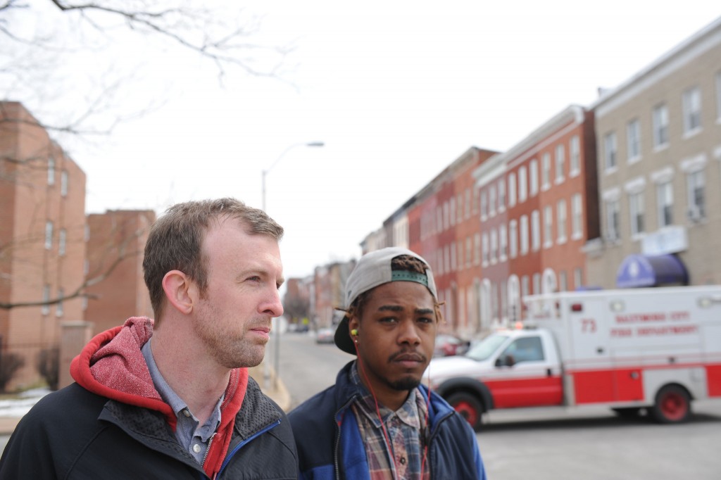 Joel Kurz (left), pastor of The Garden Church in Baltimore, spends time with church member and former drug dealer, King Thomas, who came to faith in Christ. Thomas is now a part of the church. Kurz is leading church efforts to assist in the clean up and ministry to their neighbors following a night of looting and rioting in the city April 27. NAMB file photo by Colby Ware