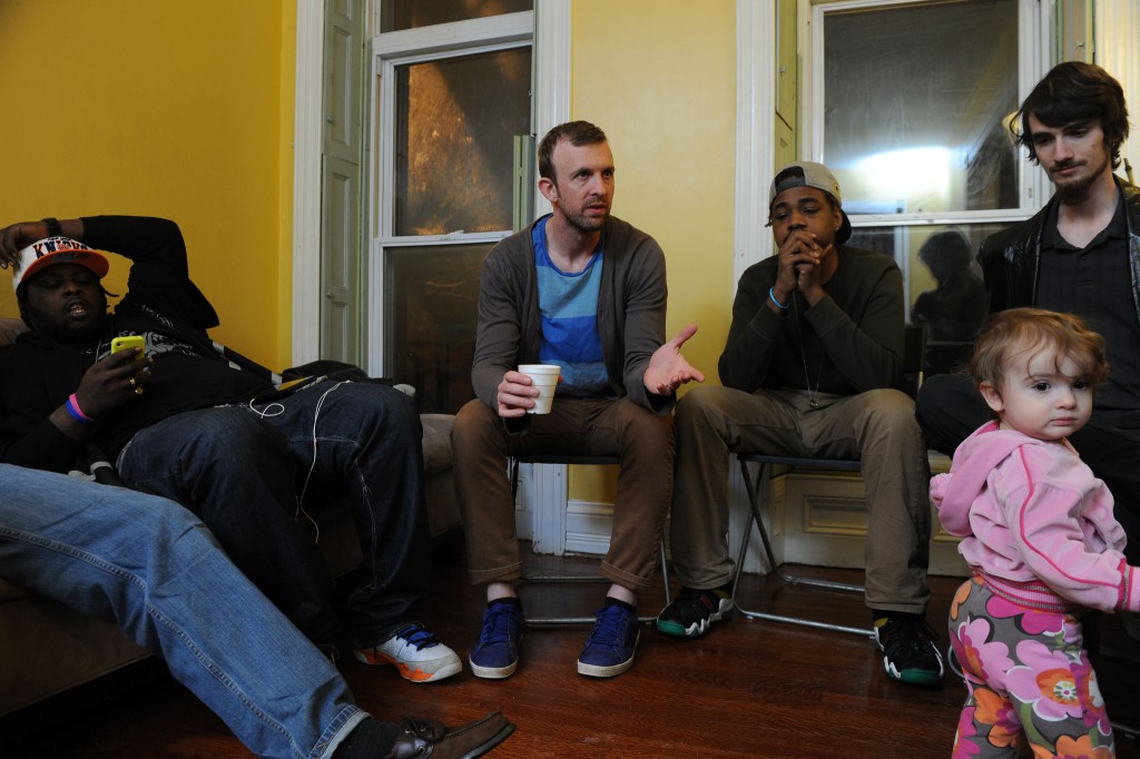 Pastor Joel Kurz (center) prepares to lead a Bible study in his home with members of The Garden Church. Kurz and members of the church are volunteering to help serve their neighbors in the aftermath of the April 27 riots in their city. NAMB file photo by Colby Ware