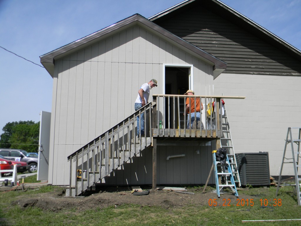 Installing stairs on the outside of the new addition.