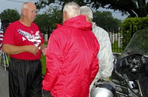 Sonny Roy (left) gives instructions to volunteers at the Ernest Roy Sr. Memorial Day Flag Relay in Mobile, Ala., held in memory of the father he never knew who was killed in combat during World War II. Photo courtesy Sonny Roy