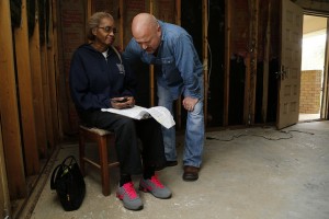 Dezzie Jackson, a 45-year resident at her home on Woods Street in Minden, La., asks for prayer with Gevan Spinney, pastor of First Baptist Church Haughton, La., after she received a phone call telling her that her vehicle was a total loss due to flood damage. NAMB photo by Stewart F. House